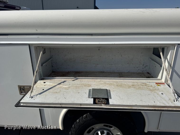 image for item FB7403 2023 GMC Sierra 2500HD Crew Cab utility bed pickup truck