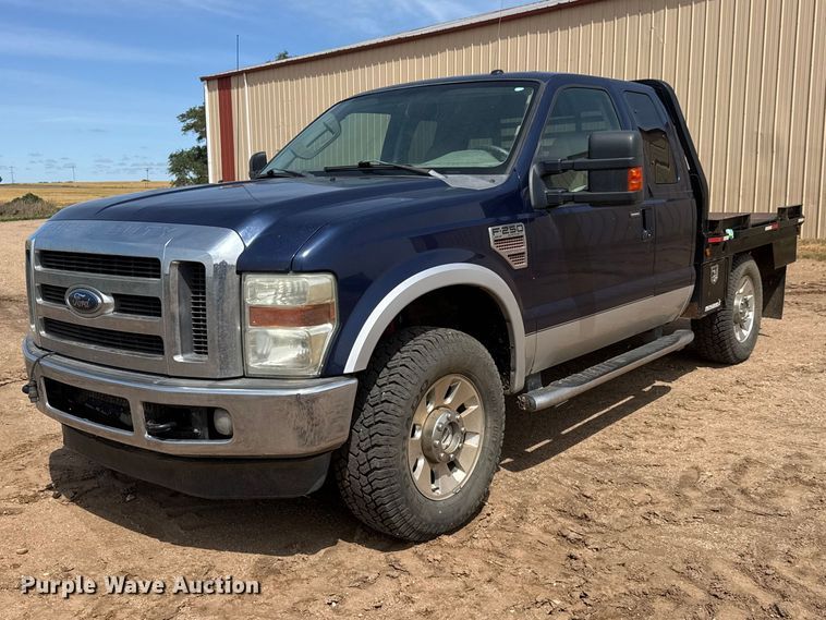 image for item NA9324 2010 Ford F250 Lariat Super Duty Ext. Cab flatbed pickup truck