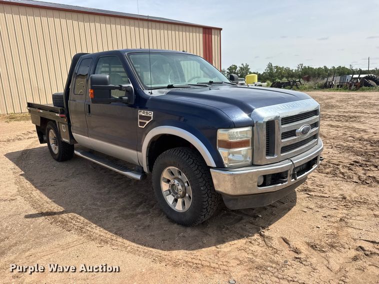 image for item NA9324 2010 Ford F250 Lariat Super Duty Ext. Cab flatbed pickup truck