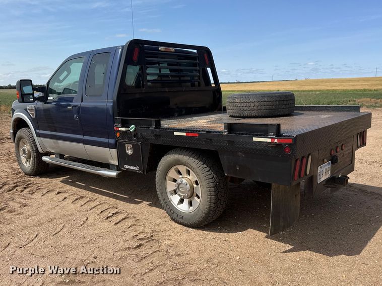 image for item NA9324 2010 Ford F250 Lariat Super Duty Ext. Cab flatbed pickup truck