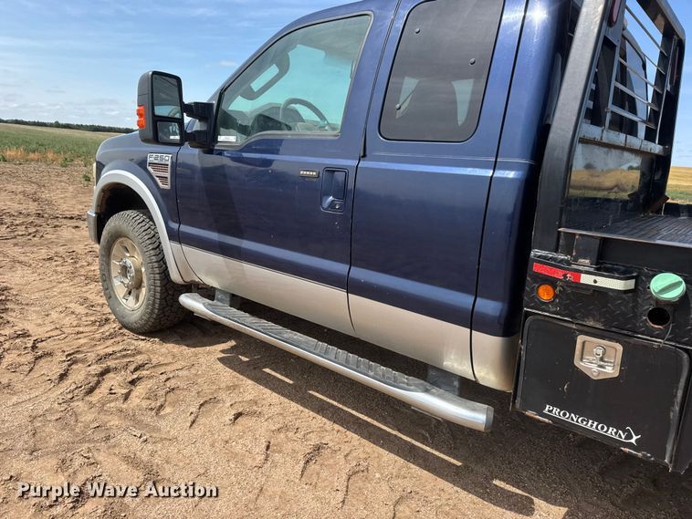 image for item NA9324 2010 Ford F250 Lariat Super Duty Ext. Cab flatbed pickup truck