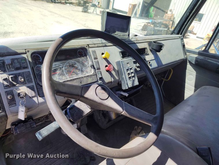 image for item EW1013 2003 Freightliner FL70 flatbed truck