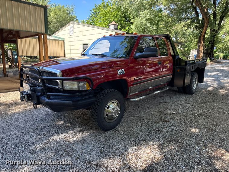 image for item EN0449 2001 Dodge Ram 3500 Ext. Cab flatbed pickup truck