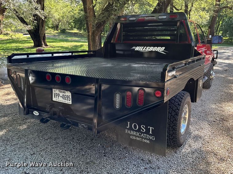 image for item EN0449 2001 Dodge Ram 3500 Ext. Cab flatbed pickup truck