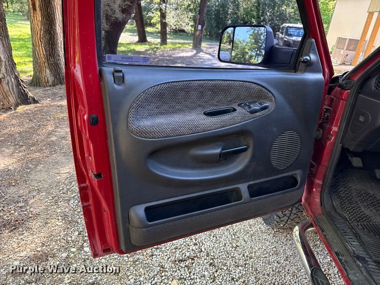 image for item EN0449 2001 Dodge Ram 3500 Ext. Cab flatbed pickup truck