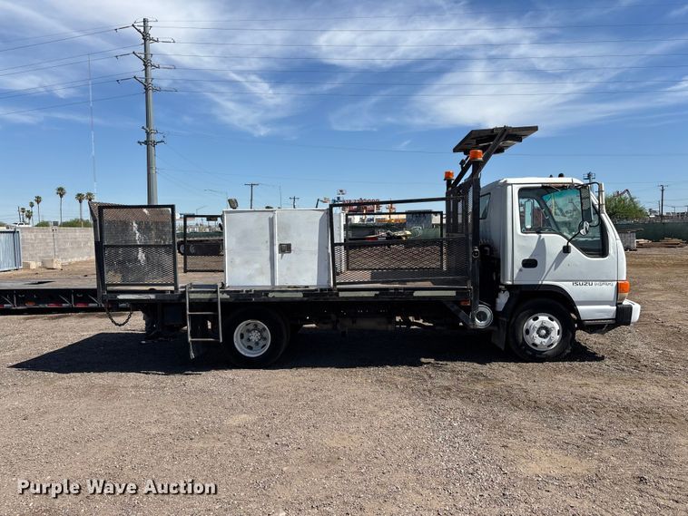image for item DW1297 1999 Isuzu NPR flatbed truck