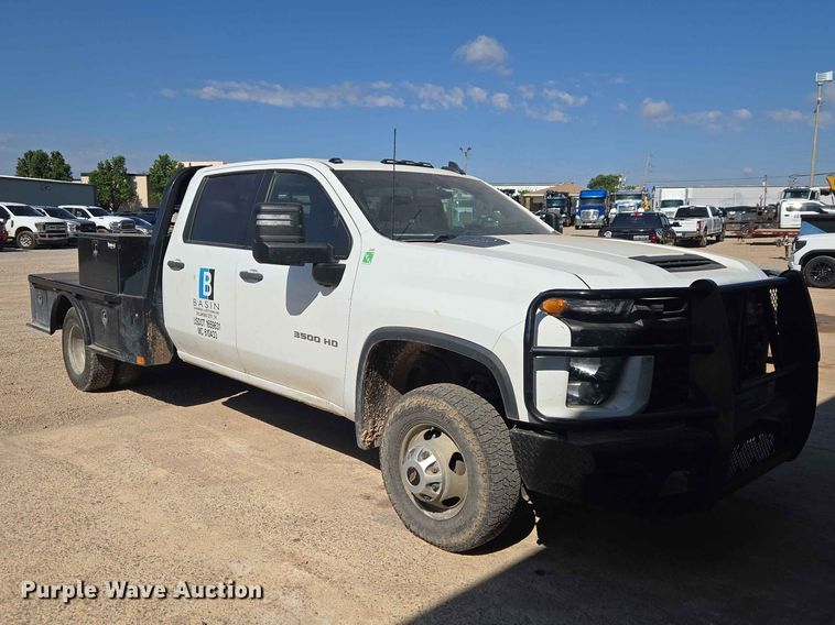 image for item EW0203 2022 Chevrolet Silverado 3500HD Crew Cab flatbed pickup truck