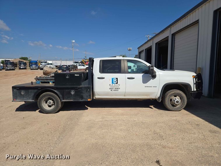 image for item EW0203 2022 Chevrolet Silverado 3500HD Crew Cab flatbed pickup truck