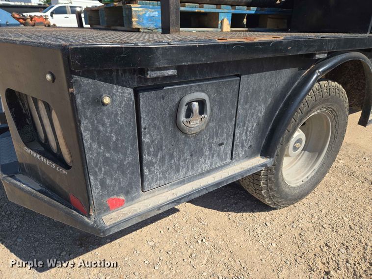 image for item EW0203 2022 Chevrolet Silverado 3500HD Crew Cab flatbed pickup truck