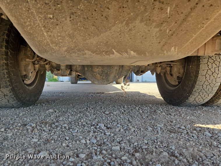 image for item EW0203 2022 Chevrolet Silverado 3500HD Crew Cab flatbed pickup truck