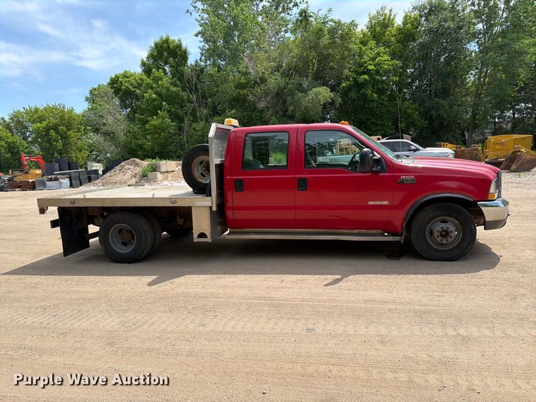 image for item FK0210 2004 Ford F350 Super Duty Crew Cab flatbed pickup truck