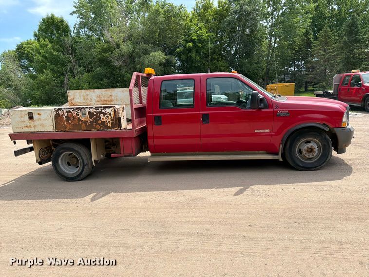image for item FK0211 2004 Ford F350 Super Duty Crew Cab flatbed pickup truck