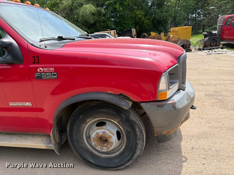 image for item FK0211 2004 Ford F350 Super Duty Crew Cab flatbed pickup truck