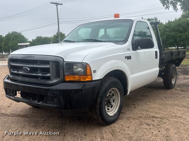 1999 Ford F250 Super Duty flatbed pickup truck