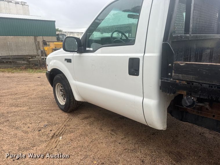 image for item MX9180 1999 Ford F250 Super Duty flatbed pickup truck