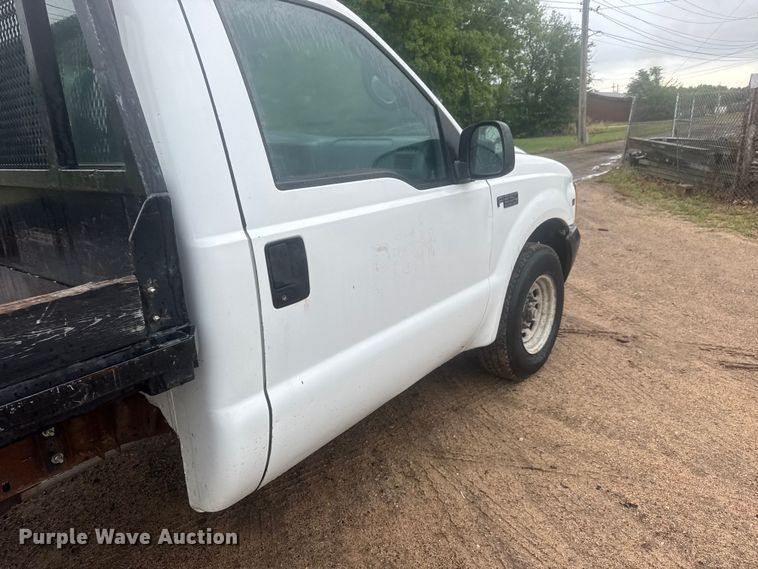 image for item MX9180 1999 Ford F250 Super Duty flatbed pickup truck