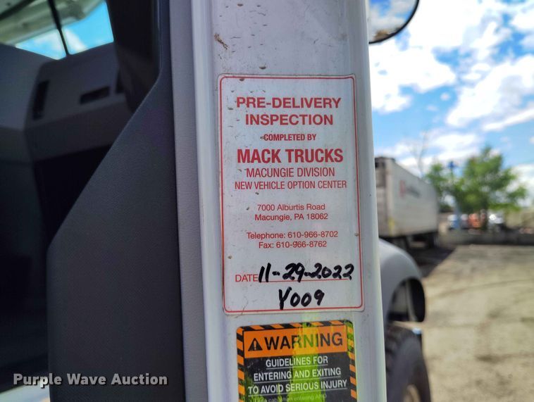 image for item ED0127 2023 Mack Granite roll-off container truck