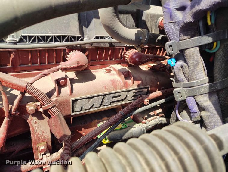 image for item ED0127 2023 Mack Granite roll-off container truck