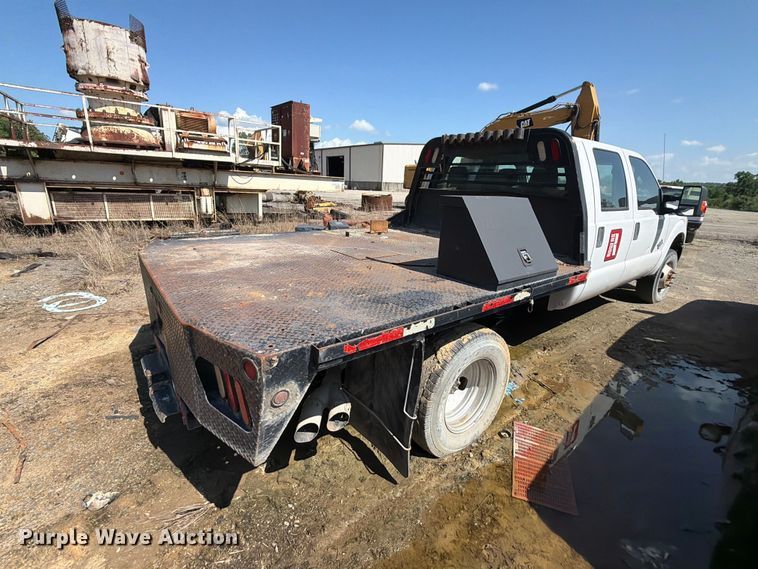 image for item EW0011 2015 Ford F350 Super Duty Crew Cab flatbed pickup truck
