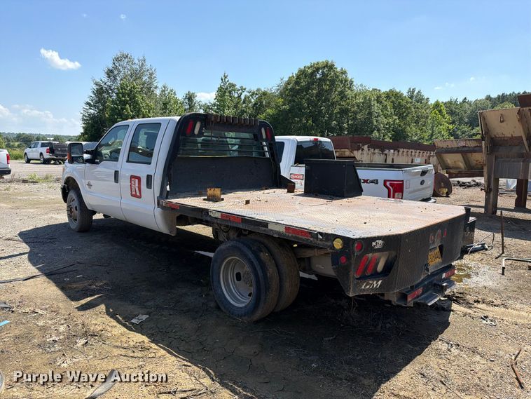image for item EW0011 2015 Ford F350 Super Duty Crew Cab flatbed pickup truck