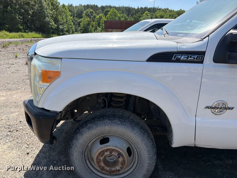 image for item EW0011 2015 Ford F350 Super Duty Crew Cab flatbed pickup truck
