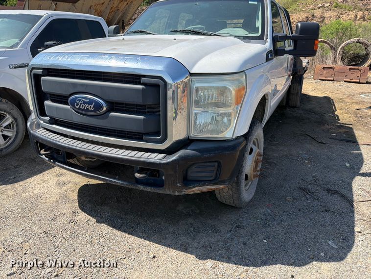 image for item EW0011 2015 Ford F350 Super Duty Crew Cab flatbed pickup truck