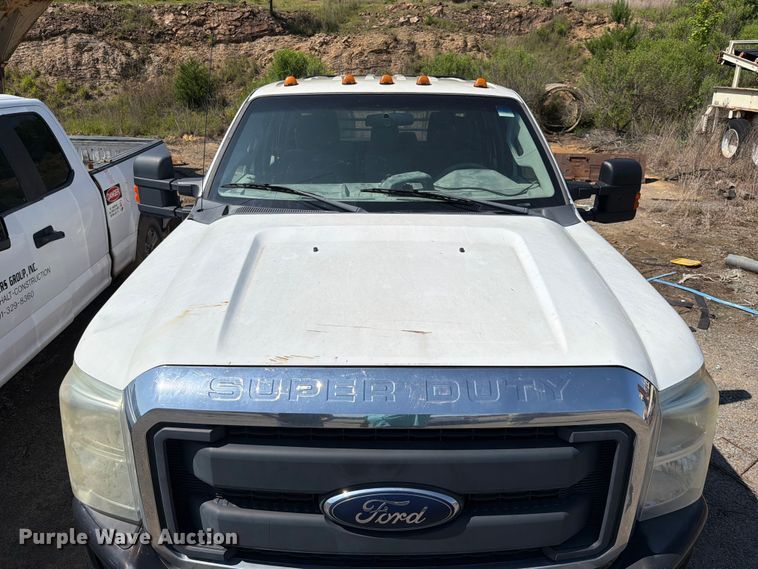 image for item EW0011 2015 Ford F350 Super Duty Crew Cab flatbed pickup truck