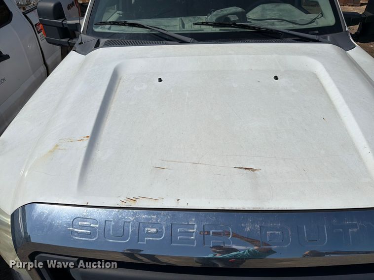 image for item EW0011 2015 Ford F350 Super Duty Crew Cab flatbed pickup truck