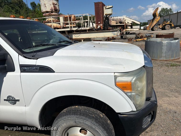image for item EW0011 2015 Ford F350 Super Duty Crew Cab flatbed pickup truck