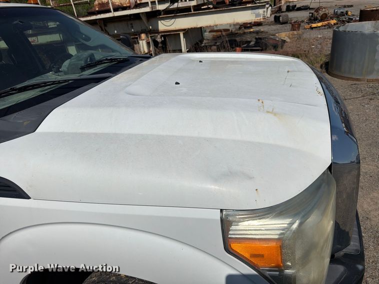 image for item EW0011 2015 Ford F350 Super Duty Crew Cab flatbed pickup truck
