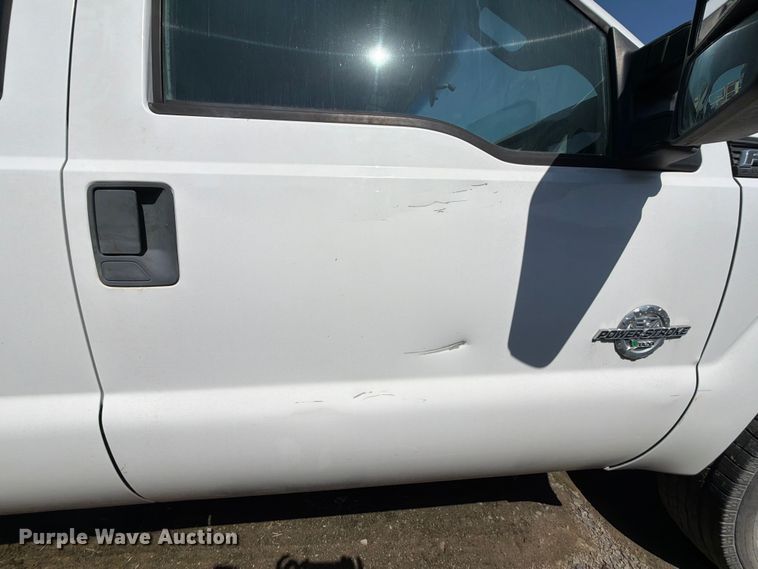image for item EW0011 2015 Ford F350 Super Duty Crew Cab flatbed pickup truck