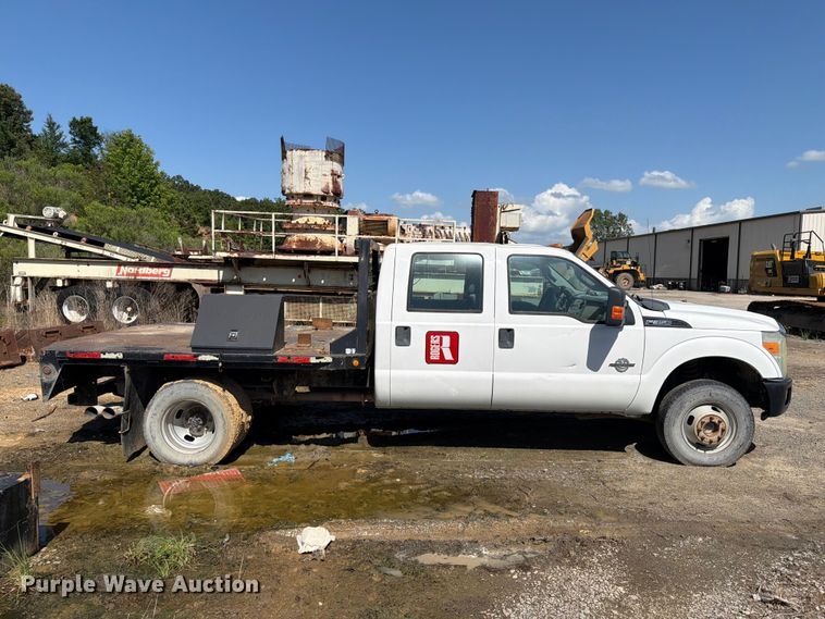image for item EW0011 2015 Ford F350 Super Duty Crew Cab flatbed pickup truck