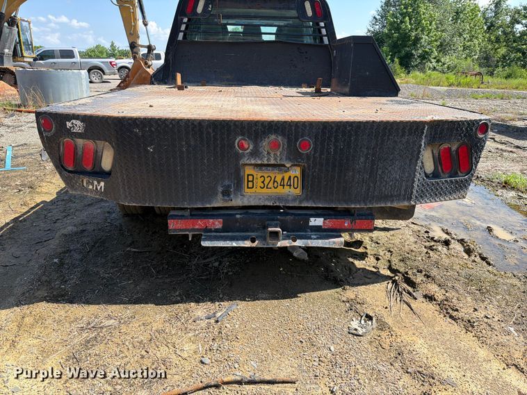 image for item EW0011 2015 Ford F350 Super Duty Crew Cab flatbed pickup truck