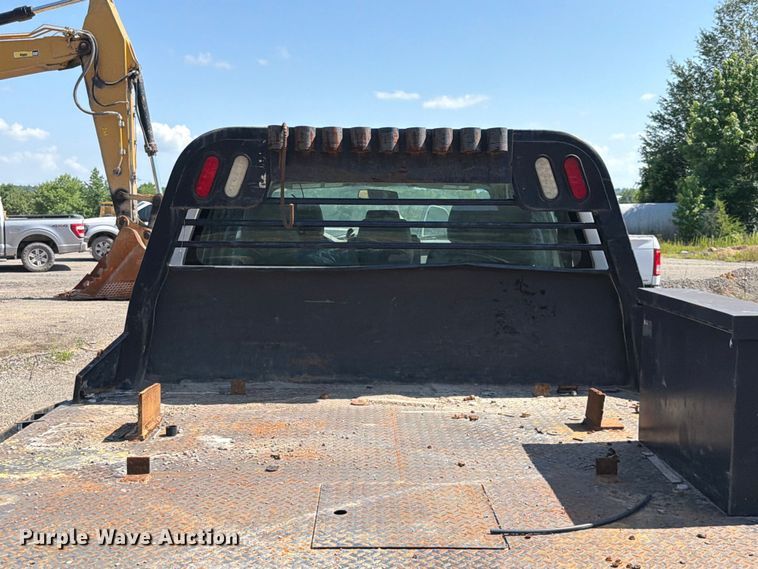 image for item EW0011 2015 Ford F350 Super Duty Crew Cab flatbed pickup truck