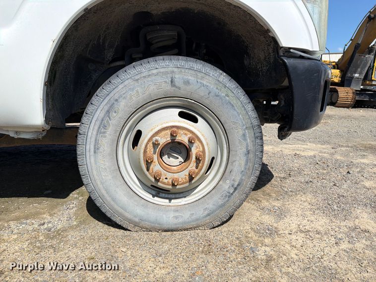 image for item EW0011 2015 Ford F350 Super Duty Crew Cab flatbed pickup truck
