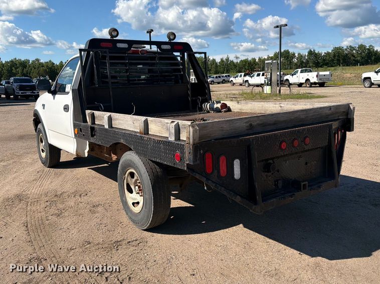 image for item DQ7920 1999 Ford F150 flatbed pickup truck