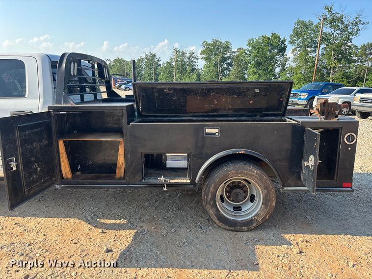 image for item DU6328 2020 RAM 5500 Crew Cab flatbed truck