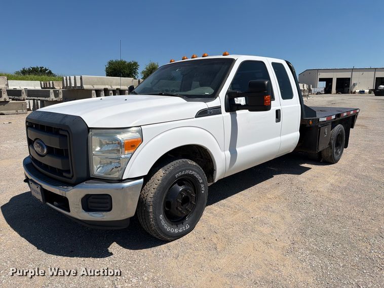 image for item FI0274 2016 Ford F350 Super Duty Ext. Cab flatbed pickup truck