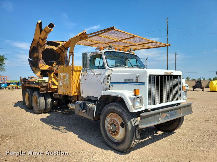 image for item EE1150 1986 GMC Bombardier truck cab and chassis with tree spade