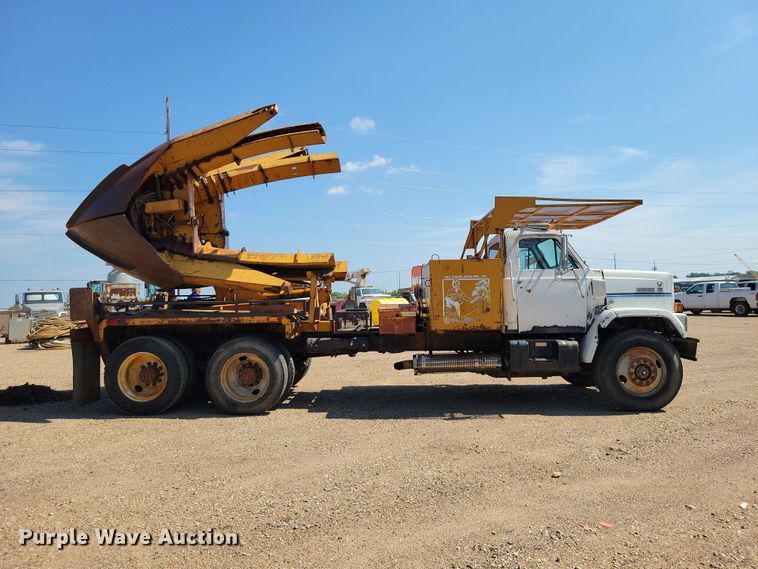 image for item EE1150 1986 GMC Bombardier truck cab and chassis with tree spade