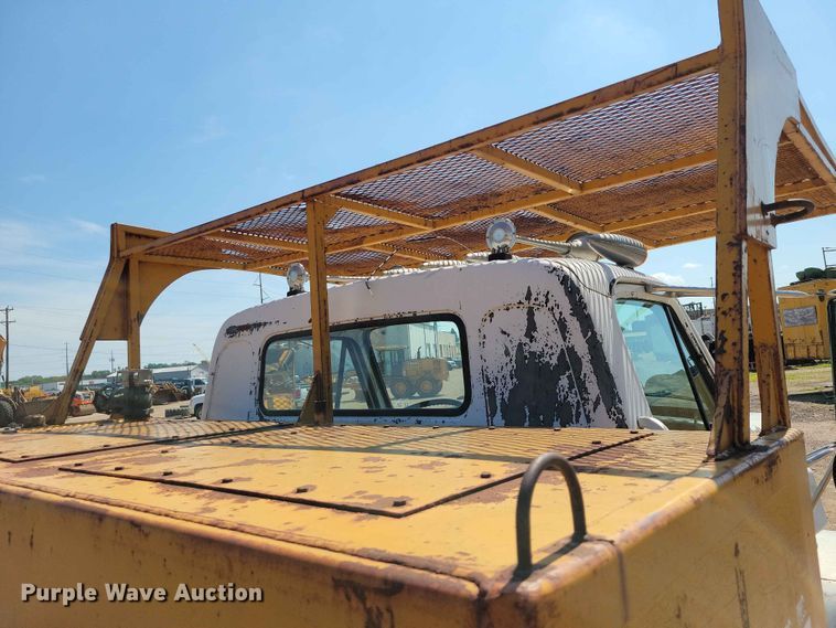 image for item EE1150 1986 GMC Bombardier truck cab and chassis with tree spade