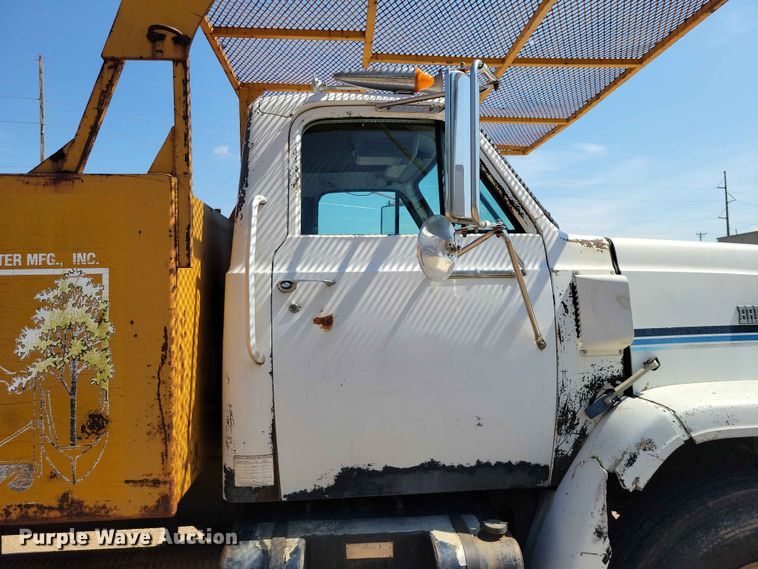 image for item EE1150 1986 GMC Bombardier truck cab and chassis with tree spade