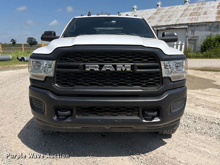 image for item EX2515 2021 RAM 2500 Heavy Duty Crew Cab flatbed pickup truck