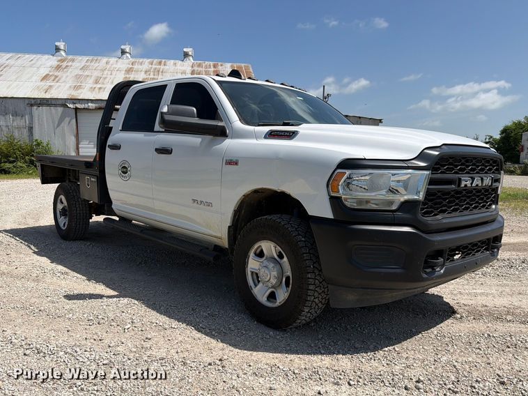 image for item EX2515 2021 RAM 2500 Heavy Duty Crew Cab flatbed pickup truck