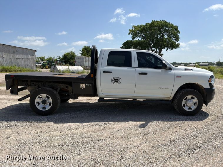 image for item EX2515 2021 RAM 2500 Heavy Duty Crew Cab flatbed pickup truck