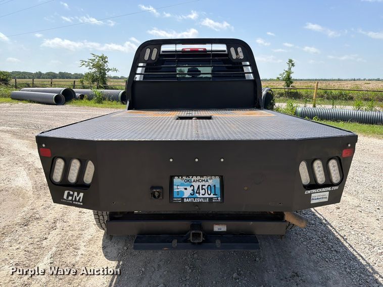 image for item EX2515 2021 RAM 2500 Heavy Duty Crew Cab flatbed pickup truck
