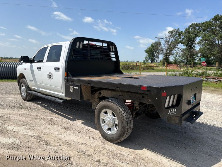 image for item EX2515 2021 RAM 2500 Heavy Duty Crew Cab flatbed pickup truck