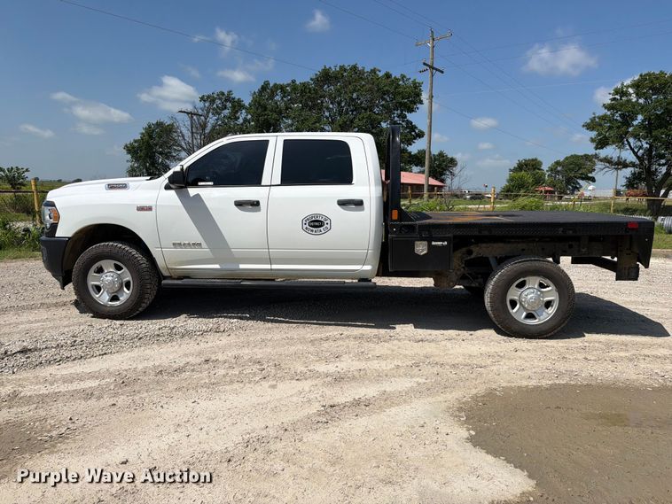 image for item EX2515 2021 RAM 2500 Heavy Duty Crew Cab flatbed pickup truck