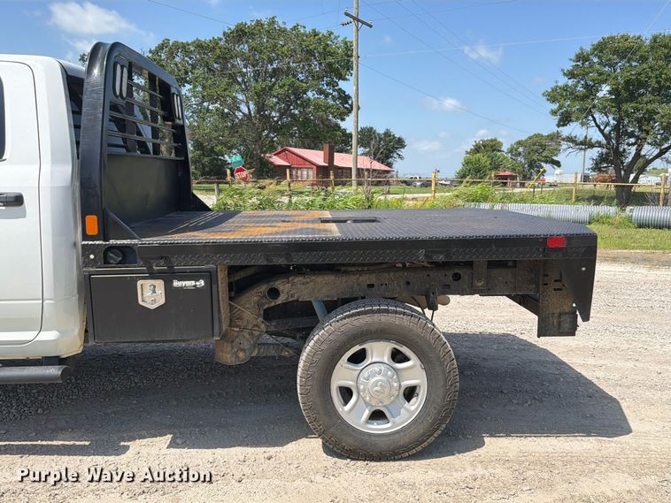 image for item EX2515 2021 RAM 2500 Heavy Duty Crew Cab flatbed pickup truck