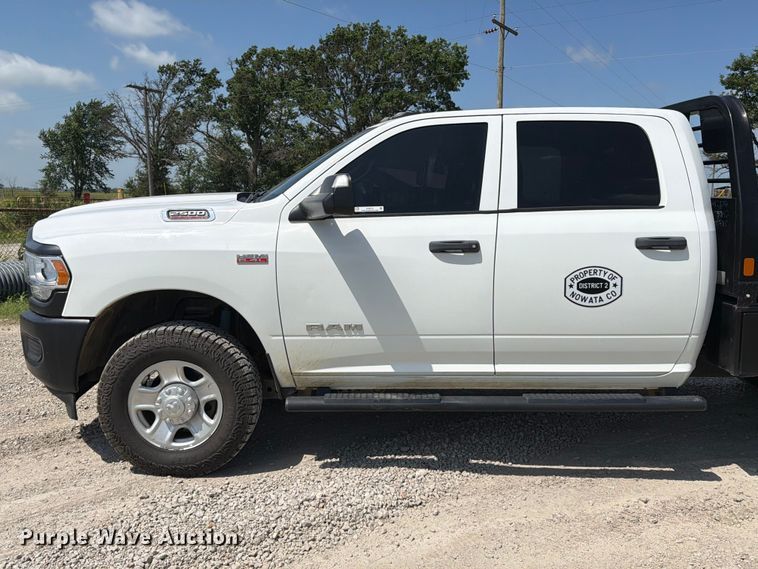 image for item EX2515 2021 RAM 2500 Heavy Duty Crew Cab flatbed pickup truck